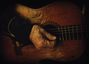 aging hand guitar